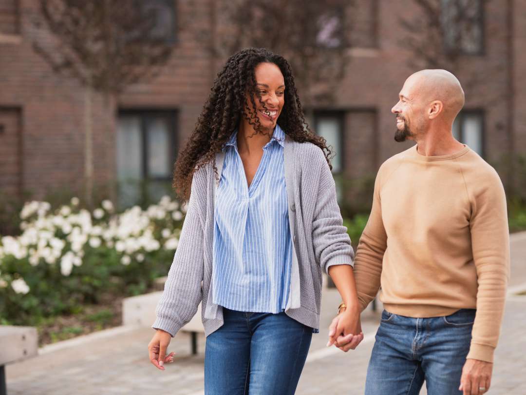 Young couple walking hand in hand