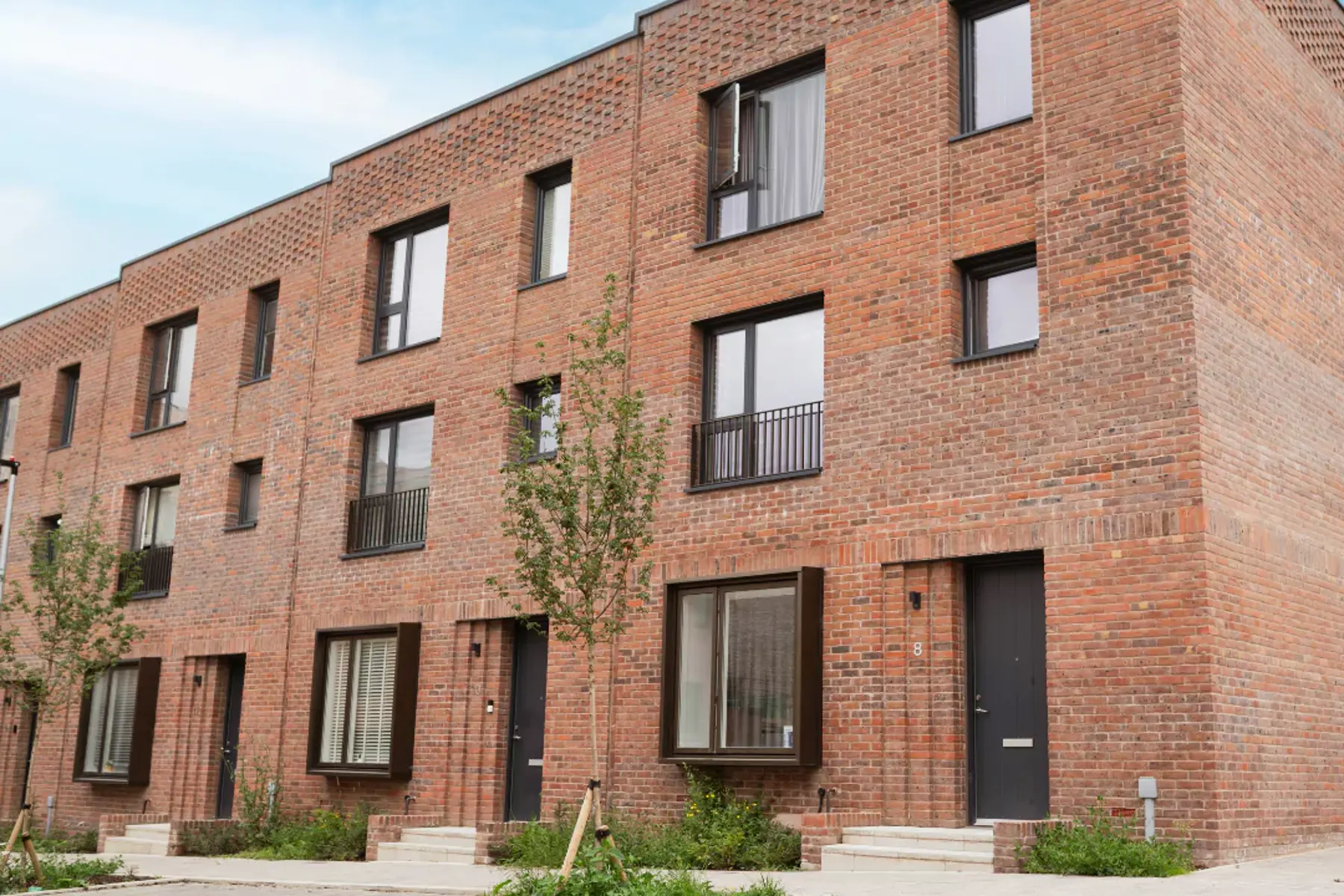The front exterior of The Brandon red-brick townhouses at Brabazon.